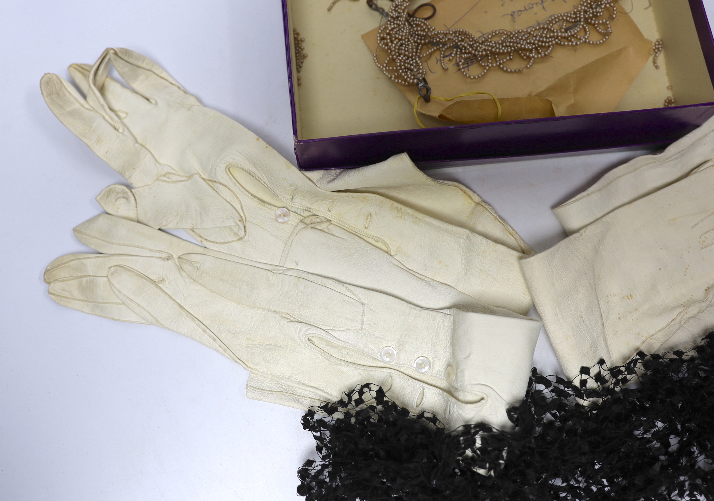 Cream leather evening gloves, bonnet veiling and decorative bridal headdress